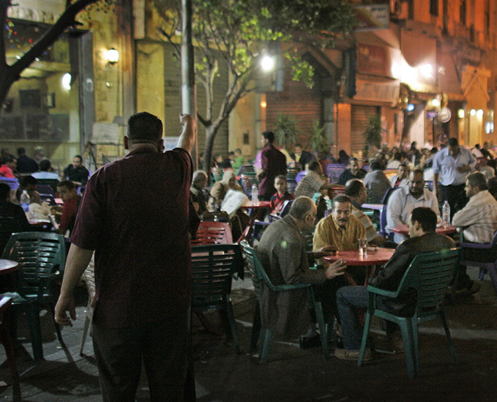 Customers of all shapes and sizes sit at street cafes in central Cairo, Egypt The Associated Press