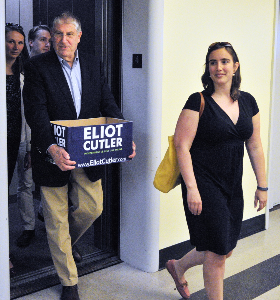 AUGUSTA, ME - MAY 29: Independent candidate for Governor Elliot Cutler, left, follows his deputy campaign manager Kaitlin Lacasse out of the elevator as they deliver petition signatures to the Secretary of State's office on Thursday May 29, 2014 in the Cross State Office Building in Augusta. A press release from the campaign said that they had over 5,500 signatures from registered Maine voters. In remarks before dropping them off Cutler called for more debates with the candidates in the race Republican Paul LePage and Democrat Mike Michaud. (Photo by Joe Phelan/Staff Photographer)