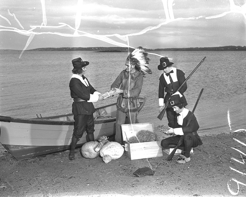 Costumed Jaycees reenact the landing of the Pilgrims on the Maine coast in search of food to take back to the Plymouth colony. Left to right are Bruce C. McGorrill, James E. Demetriou, portraying Squanto; Richard E. Oransky, and O. William Robertson.
