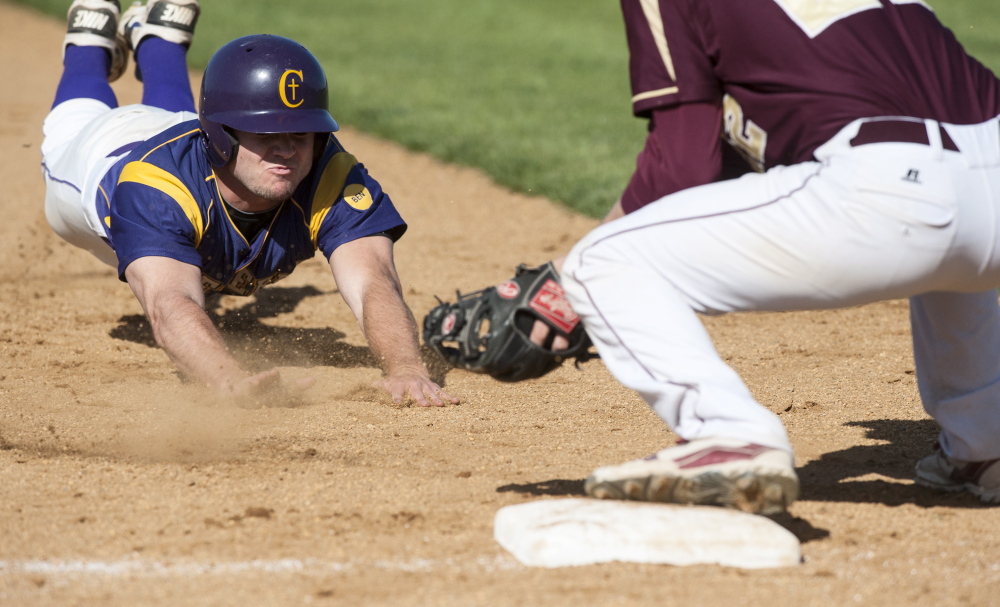 Brad Carney of Cheverus slides into third base but finds the ball waiting for him Thursday as Alex Fallon of Thornton Academy applies the tag during the second inning of Thorntonâs 4-3 victory. Logan Werlinger/Staff Photographer