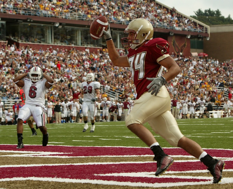 In this 2004 file photo, a Boston College football celebrates at touchdown at Alumni Stadium in Chestnut Hill, Mass. A city councilor has proposed a bill that would prevent Boston's schools from revoking scholarships when athletes are injured or otherwise fall out of favor with coaches.