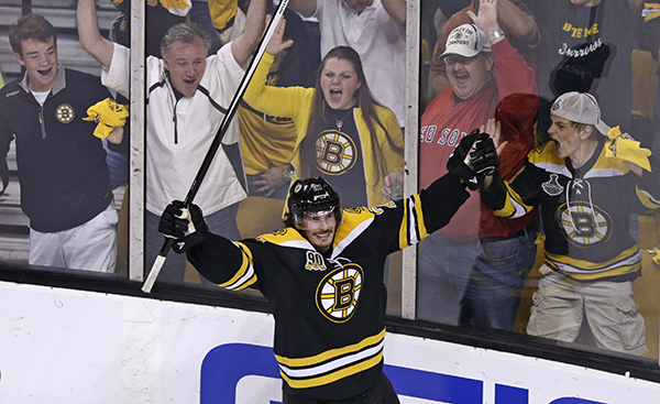Boston Bruins left wing Loui Eriksson (21) celebrates his goal against Montreal Canadiens goalie Carey Price during the third period of Game 5 in the second-round of the Stanley Cup hockey playoff series in Boston, Saturday.