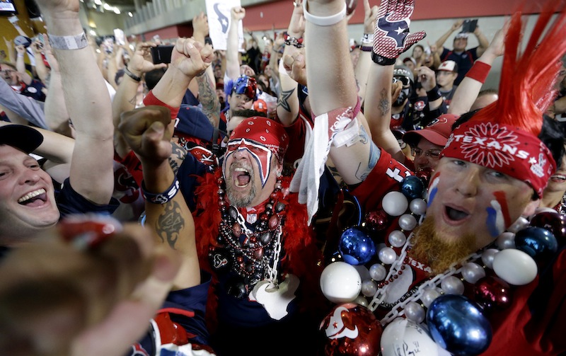 Houston Texans fans celebrate after the Houston Texans chose South Carolina defensive end Jadeveon Clowney as the number one overall pick.