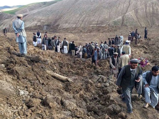 Afghans search for survivors after a landslide buried their village Friday in Badakhshan province, northeastern Afghanistan.