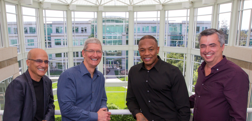 From left, music entrepreneur and Beats Electronics co-founder Jimmy Iovine, Apple CEO Tim Cook, Beats co-founder Dr. Dre, and Apple Senior Vice President Eddy Cue pose together at Apple headquarters in Cupertino, Calif., Wednesday. Apple announced that it has struck a deal to buy Beats, a headphone and music streaming specialist. The Associated Press/Apple
