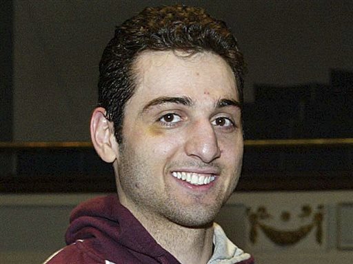 Tamerlan Tsarnaev smiles after accepting a trophy for winning the 2010 New England Golden Gloves Championship in Lowell, Mass., in this Feb. 17, 2010, photo.