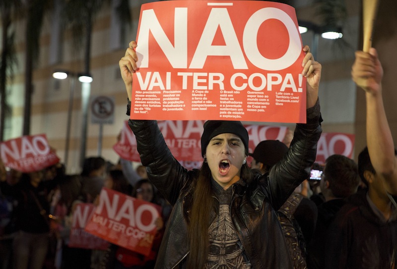 A demonstrator holding a banner that reads in Portuguese "There won't be a Cup" protests against money spent on the World Cup preparations in Sao Paulo on April 29.