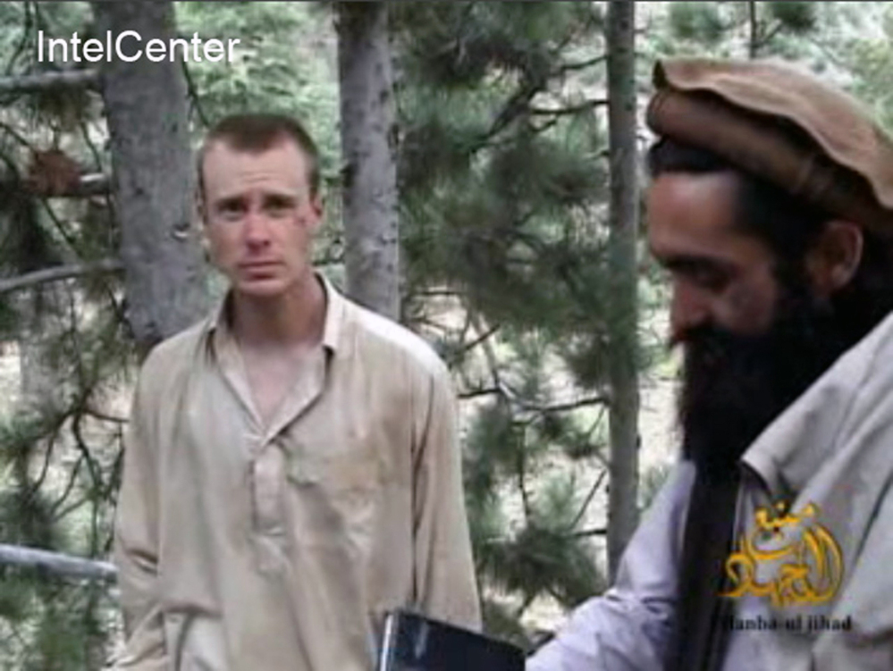 A man believed to be Sgt. Bowe Bergdahl is shown at left in this frame grab image provided in 2010 from a video released by the Taliban. The Associated Press