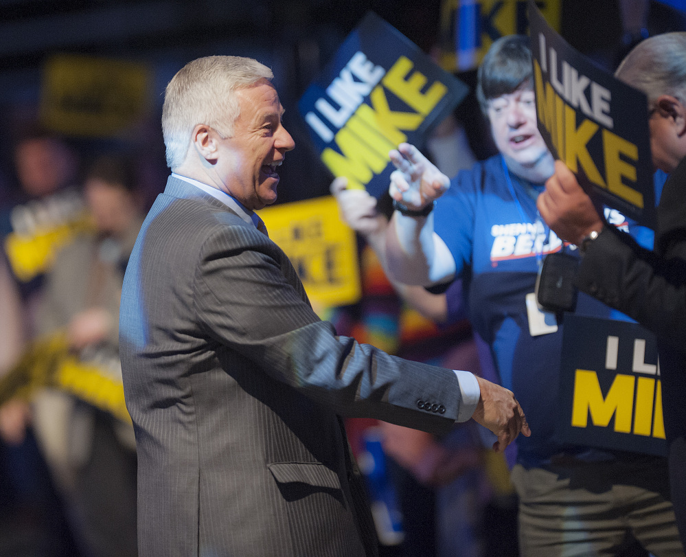 U.S. Congressman Mike Michaud, a candidate for governor in Maine, is welcomed to  speak at the Maine Democratic Convention in Bangor, Maine, Saturday,  May 31, 2014. (AP Photo/Michael C. York)