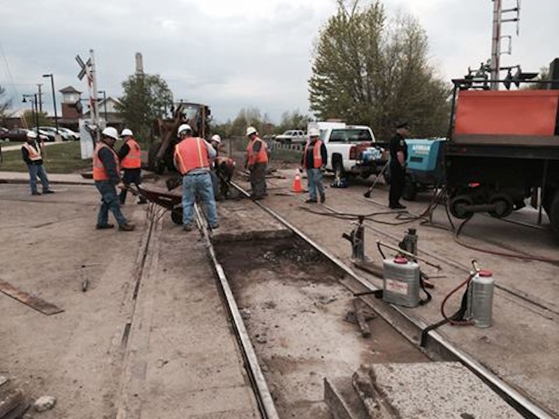 Pan Am Railways maintenance crews had more difficulty than expected removing a rail Thursday at the crossing with Main Street, causing delays.
