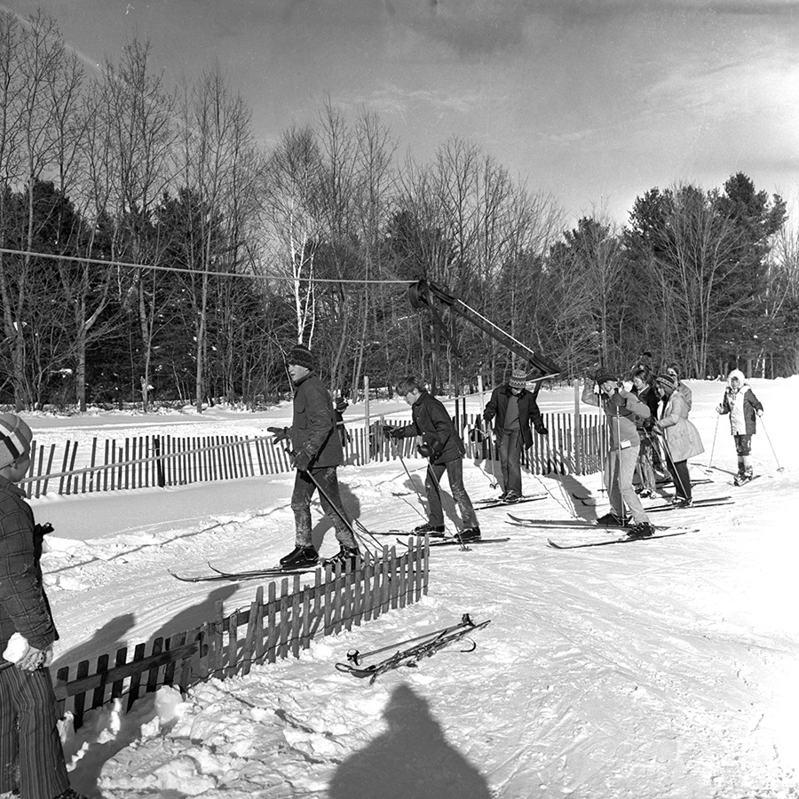 Skiers line up to ride up the rope tow at the Gorham Community Ski Tow in this photo from the Dec. 31, 1970 Portland Evening Express. Courtesy of Portland Public Library Special Collections & Archives.