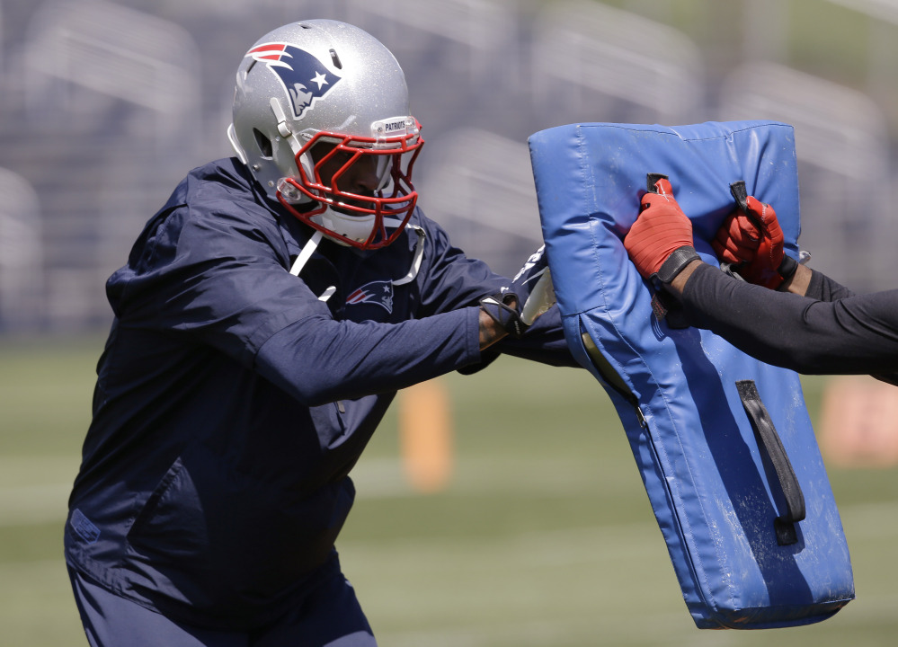 New England Patriots corner back Darrelle Revis (24) works a drill during an organized team activity at the NFL football teamâs facility Friday, May 30, 2014 in Foxborough, Mass. The Associated Press/Stephan Savoia