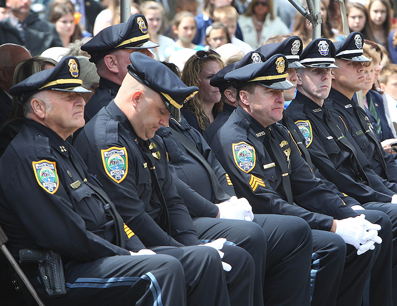 Brentwood, N.H., police officers listen during Monday's ceremony to honor Law Enforcement officers who died in the line of duty, held in Concord, N.H.