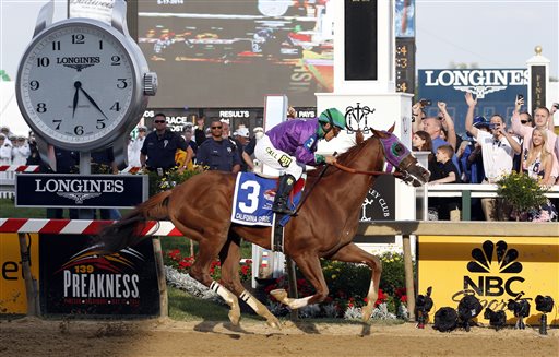 California Chrome, ridden by jockey Victor Espinoza, wins the 139th Preakness Stakes horse race at Pimlico Race Course on Saturday in Baltimore. Horse Race;Pimlico;Preakness