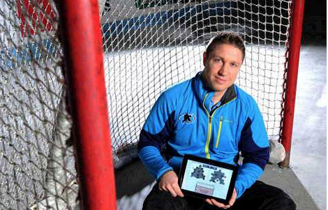 Dan Kerluke, a former UMaine hockey player and coach and the CEO of Double Blue Sports Analytics in Orono, displays Double Blue’s app for training hockey goalies.