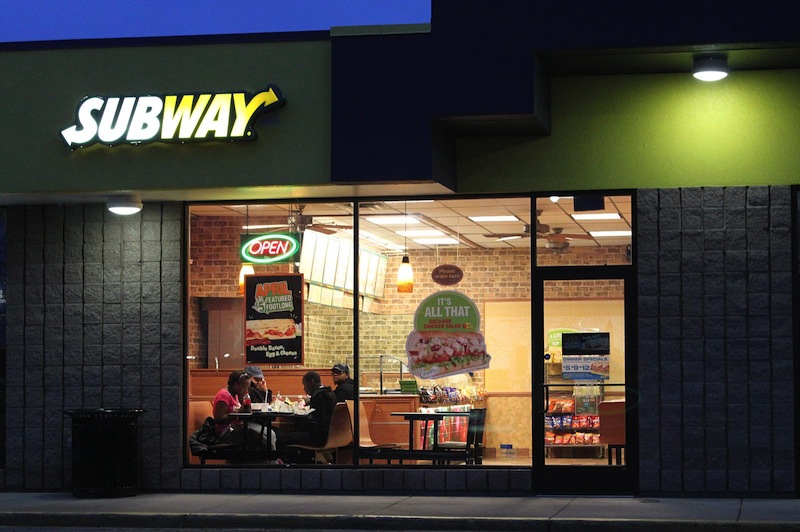Subway is expanding both its menu and its stores by adding hummus to its offerings and franchises to its ever-growing empire, even as U.S. fast-food chains struggle to boost revenue.