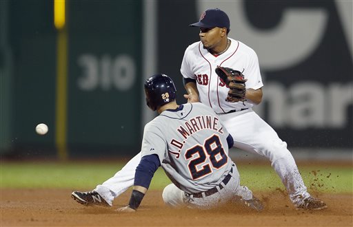 Tigers left fielder J.D. Martinez steals second base as Red Sox shortstop Xander Bogaerts gets the throw in the fourth inning in Boston on Sunday.