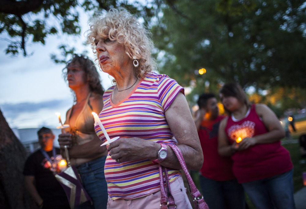 Denee Mallon attends a vigil Thursday in Albuquerque, N.M. A U.S. Department of Health and Services review board ruled Friday in favor of Mallon, 74, an Army veteran, whose request to have Medicare pay for her genital reconstruction was denied two years ago. The Associated Press