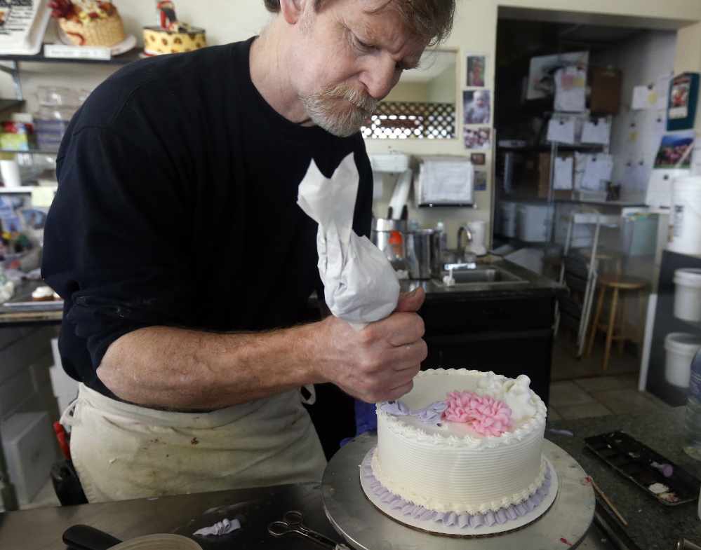 Jack Phillips decorates a cake at his Masterpiece Cakeshop in Lakewood, Colo. âI will stand by my convictions until somebody shuts me down,â he said. The Associated Press