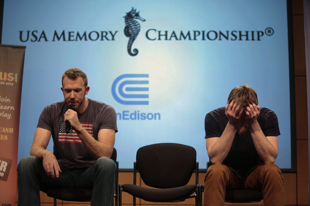 Nelson Dellis, left, of Miami, recalls cards while Alexander Mullen, of Oxford, Miss., concentrates during the 17th annual USA Memory Championship in New York on Thursday. Carolyn Cole/Los Angeles Times/MCT