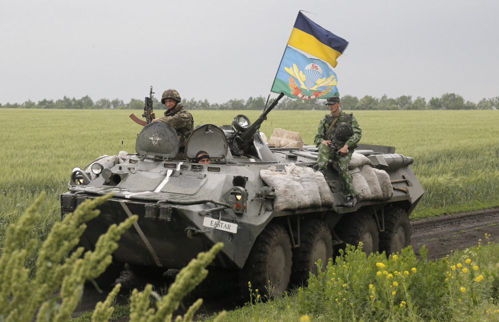 Ukrainian army paratroopers move to position in Slovyansk, Ukraine, on Saturday. The Ukrainian Acting Defense Minister said on Friday that troops had ousted separatists from southern and western parts of the Donetsk region and north of the Luhansk region. The Associated Press