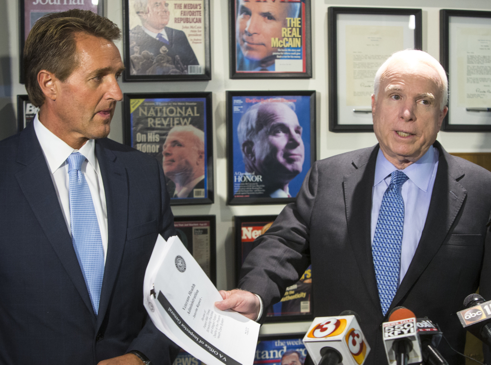 Arizona Republican Sens. John McCain, right, and Jeff Flake called for the VA chief to resign following a report on patients kept waiting at the Phoenix veterans hospital. 