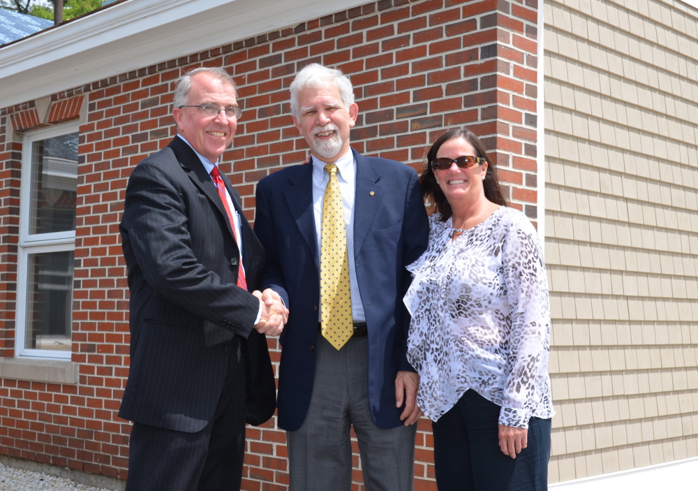 CAPTION: (from left) Glenn Hutchinson, president and chief executive officer of Bath Savings Institution; Laurence Gross, executive director of Southern Maine Agency on Aging; and Polly Bradley, Southern Maine Agency on Aging director of Adult Day Services pause to celebrate following the announcement of a $50,000 gift from Bath Savings Institution to the Southern Maine Agency on Agingâs to support the building of two new adult day centers that will provide services to adults with Alzheimerâs disease and other forms of dementia. Photo courtesy Jessica LeBlanc