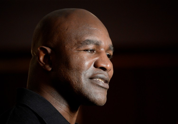 Former five-time heavyweight boxing champion Evander Holyfield speaks with the media during a ceremony at which he was given a key to the city at the Portland Regency Hotel and Spa on Friday.