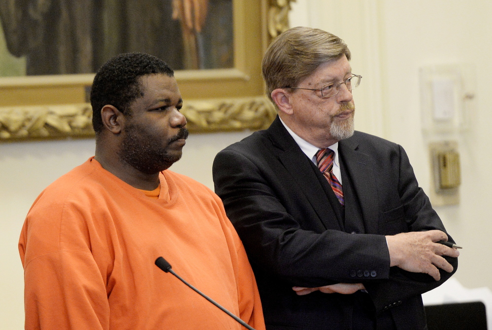  Lebon Bruno stands with defense attorney Clifford Strike in York County Superior Court in Alfred on Thursday. Bruno was sentenced to 33 years in prison for beating and killing a woman in 2012.