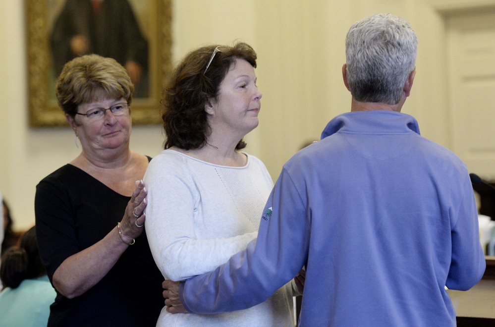  Left to right, Catherine Magee, Suzanne Williams Chapman and Geoffrey Williams, siblings of Elizabeth Williams, comfort one another after speaking in court Thursday.