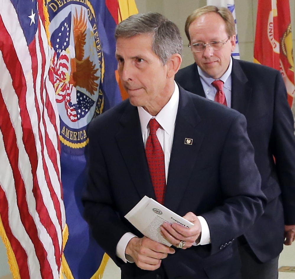 Acting Secretary of Veterans Affairs Sloan Gibson leaves after speaking Thursday on his first visit to Phoenix since taking over the agency amid a scandal of veterans being kept off the official waiting list at the Arizona hospital.
The Associated Press