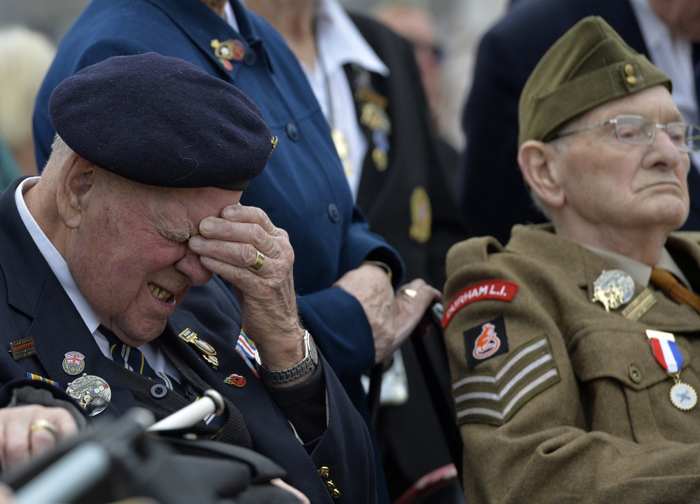 A British D-Day veteran reacts during a commemoration ceremony and parade by the British Army 3rd Division at Hermanville-sur-Mer on the Normandy coast Thursday. Reuters