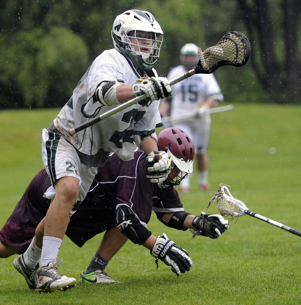 Cooper Chap of Waynflete leaves Perrin Davidson of Freeport behind while advancing toward the goal during Waynflete’s 20-11 victory at Portland. Waynflete will face Greely in the first round of the playoffs.