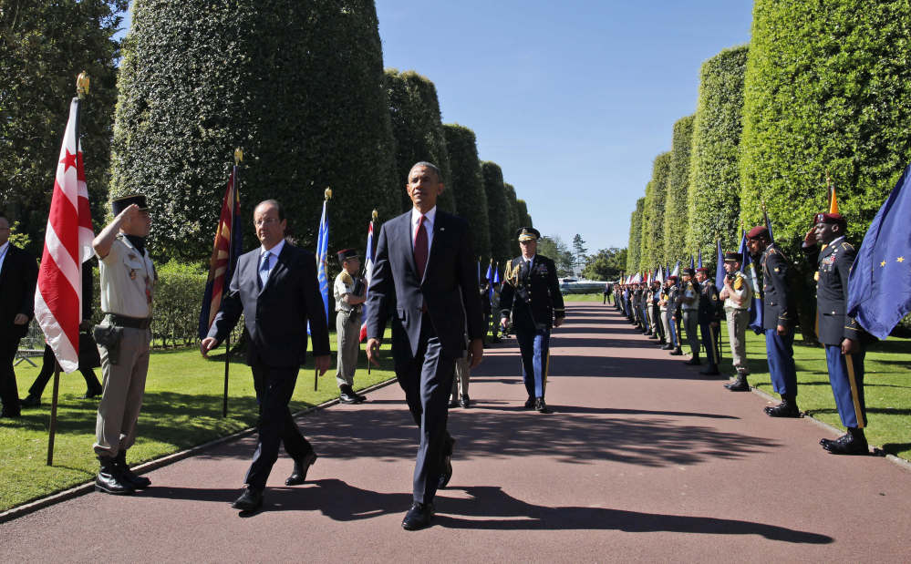 The Associated Press President Obama and French President Francois Hollande arrive at Normandy American Cemetery at Omaha Beach to participates in the 70th anniversary of D-Day, in Colleville sur Mer in Normandy, France, Friday.