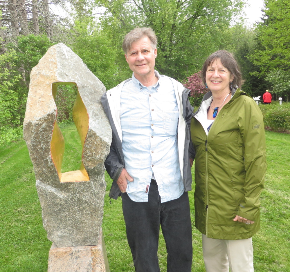 Sculptor Gary Haven Smith with his wife, Susan Pratt-Smith, beside his piece “Kennen,” an Old English word for “view,” at Gilsland Farm.