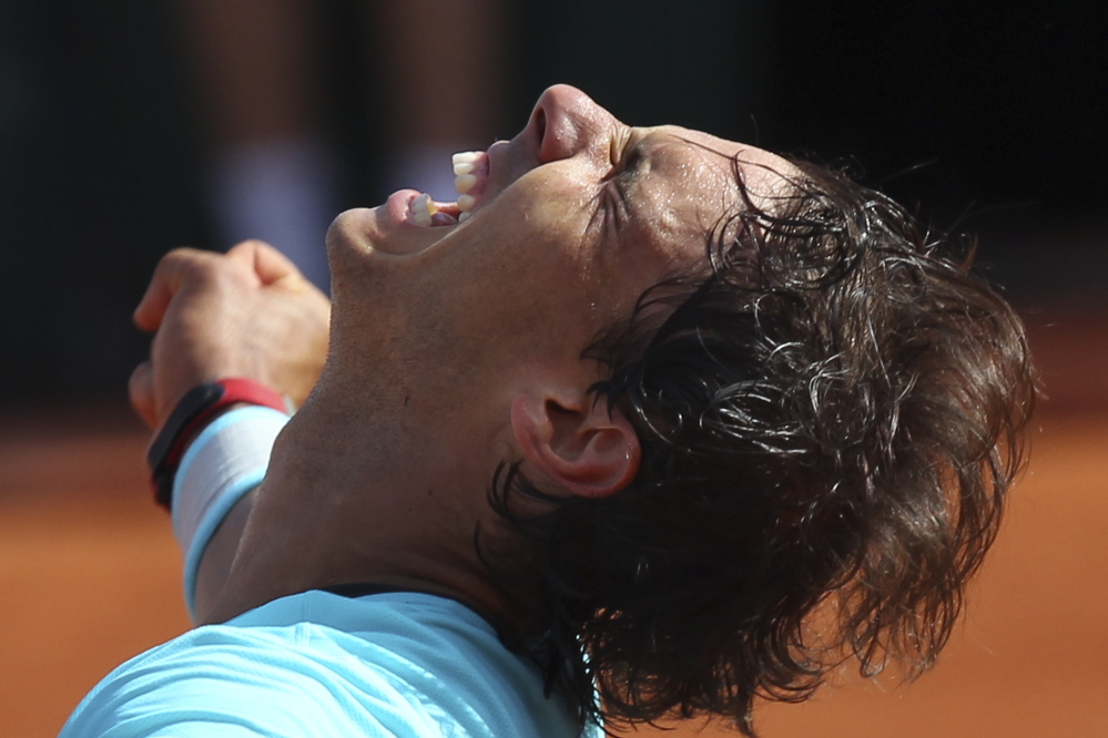 Spain’s Rafael Nadal celebrates winning the semifinal match of the French Open tennis tournament against Britain’s Andy Murray at the Roland Garros stadium, in Paris, France, on Friday.