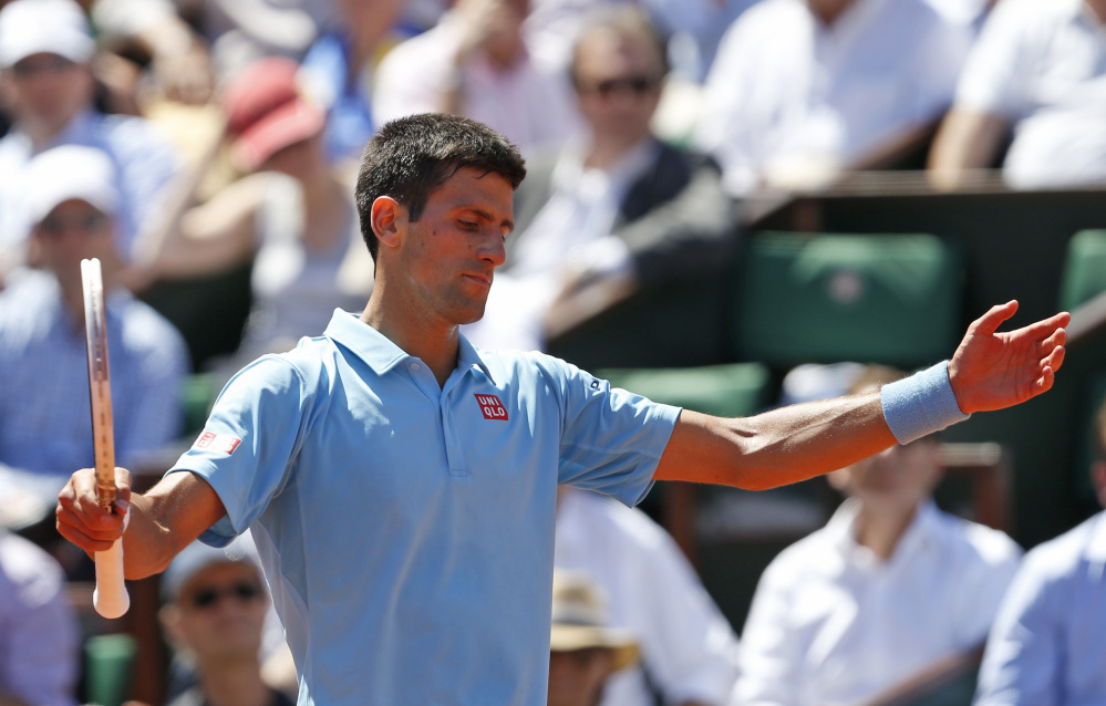 Serbia’s Novak Djokovic gestures during the semifinal match of the French Open tennis tournament against Latvia’s Ernests Gulbis at the Roland Garros stadium, in Paris, France, on Friday.