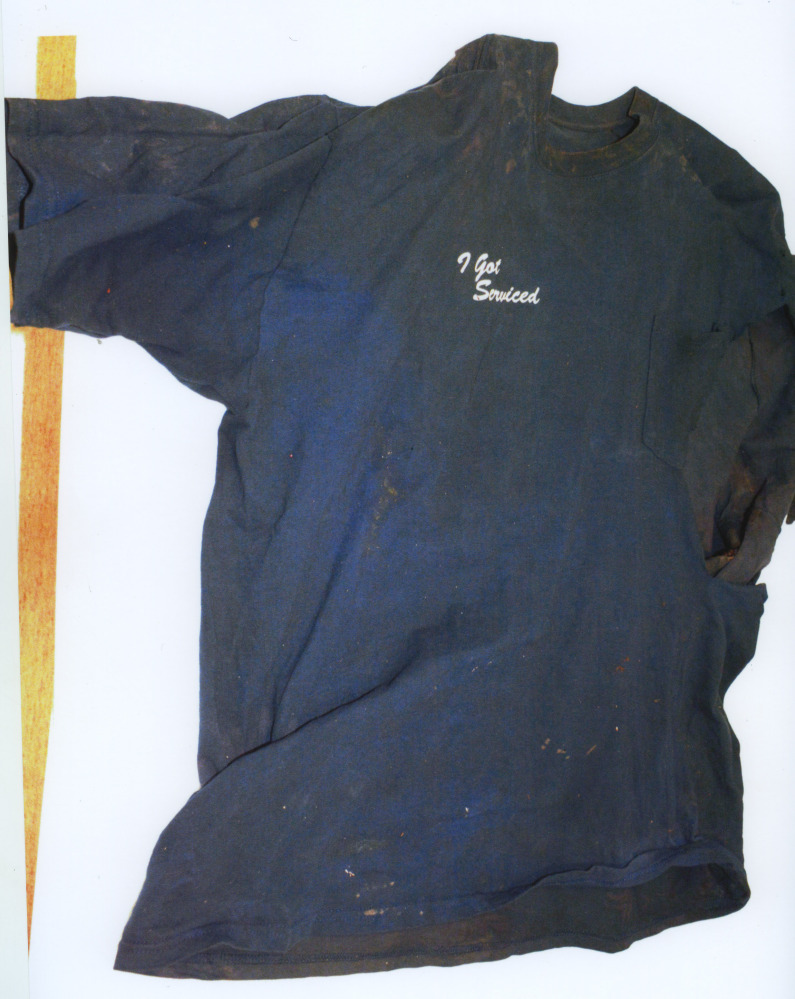 This photo released by the Cape and Islands District Attorney’s office on Friday June 6, 2014 shows the shirt that was on a mutilated body found Wednesday, June 4, 2014 at Town Neck Beach in Sandwich, Mass. On Friday, authorities appealed for public help to identify the decapitated, limbless torso of a man found wrapped in a tarp.