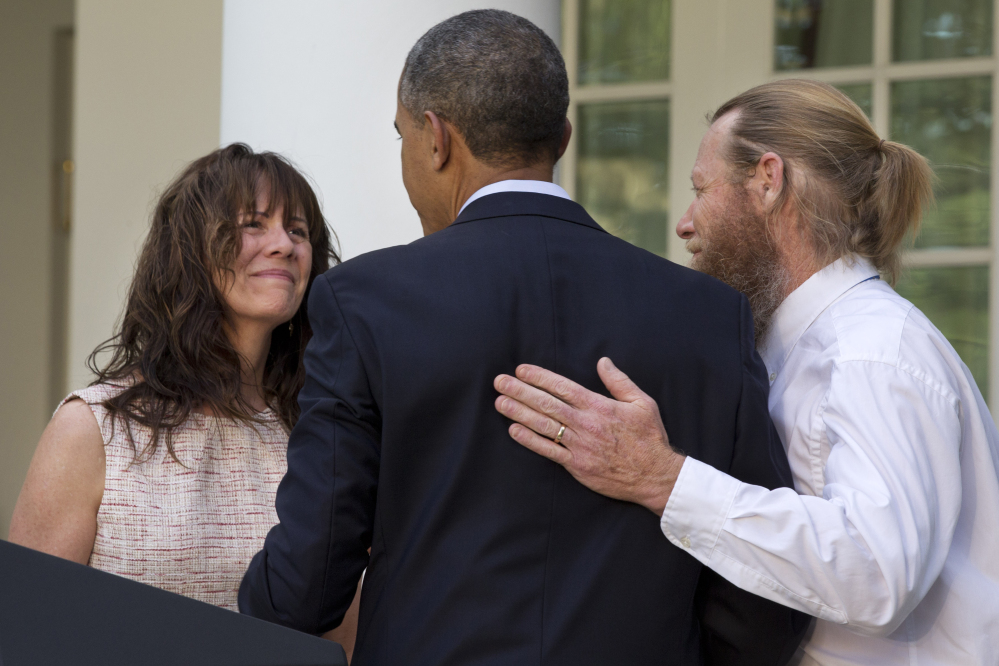 The Assoicated Press File Photo This May 31, 2014 file photo shows the parents of U.S. Army Sgt. Bowe Bergdahl, Jani Bergdahl, left, and Bob Bergdahl, turn to President Barack Obama after he spoke in the Rose Garden of the White House. Just a week after the president announced that Sgt. Bowe Bergdahl had been freed in Afghanistan, details emerging about the soldier, the deal and how the rescue came together have become a source of controversy.