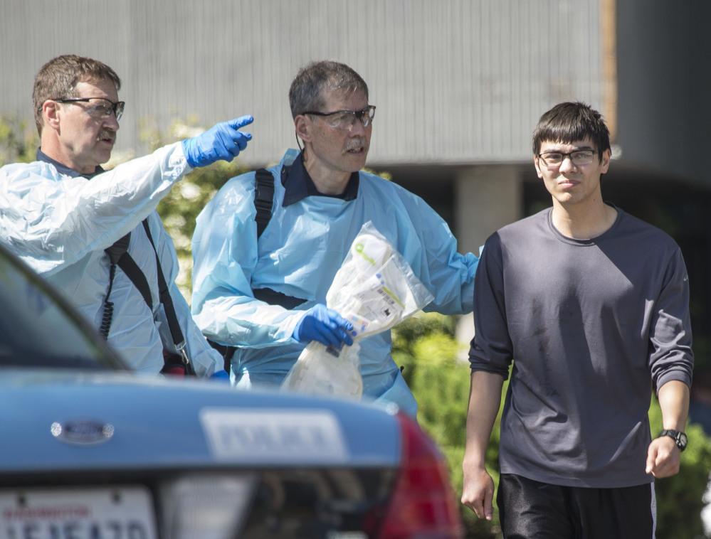 Jon Meis is taken from the shooting scene. The Associated Press/
The Seattle Times,
Dean Rutz