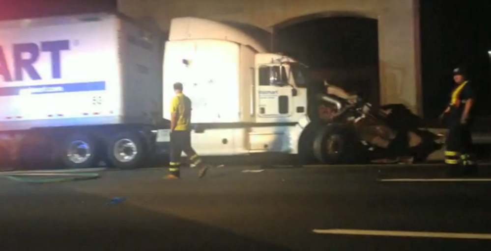 The Associated Press In this image from video the Wal-Mart truck involved in the crash of the limousine bus carrying Tracy Morgan and six other people is seen early Saturday morning June 7, 2014 on the New Jersey Turnpike at the accident scene. Morgan remained hospitalized as state and federal officials continued their investigation of the six-vehicle crash on the New Jersey Turnpike that took the life of a Morgan friend and left two others seriously injured, authorities say. Wal-Mart President Bill Simon said in a statement a Wal-Mart truck was involved and that the company “will take full responsibility” if authorities determine that its truck caused the accident.