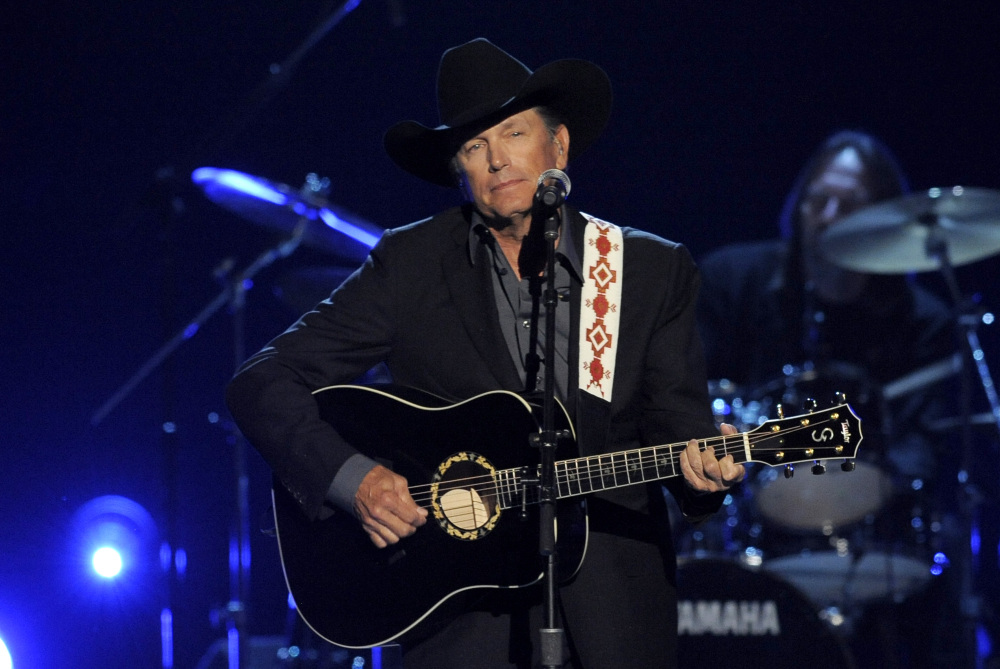 The Associated Press/Invision/Chris Pizzello This April 7, 2013 file photo shows George Strait performing at the 48th Annual Academy of Country Music Awards at the MGM Grand Garden Arena in Las Vegas. It’s the end of the trail for country music king George Strait, who will wrap up his final tour Saturday, June 7, with a star-filled show at the lavish home of the Dallas Cowboys in his home state of Texas.