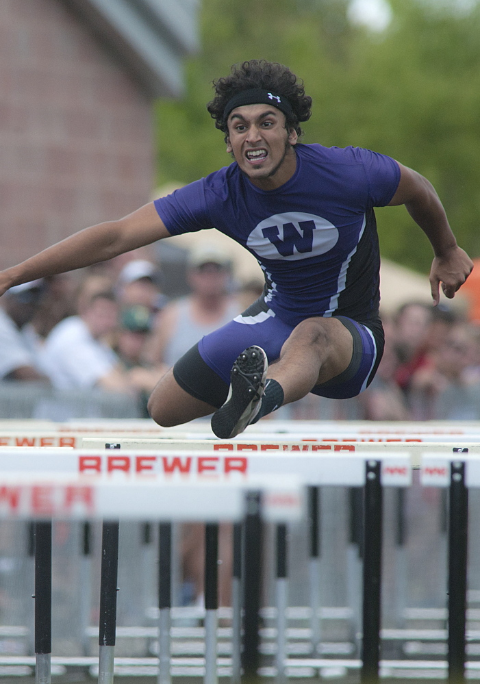 Michael C. York/Special to the Telegram Waterville’s Shahzaib Khan, competes in the 110 meter hurdles in the State Class B track meet