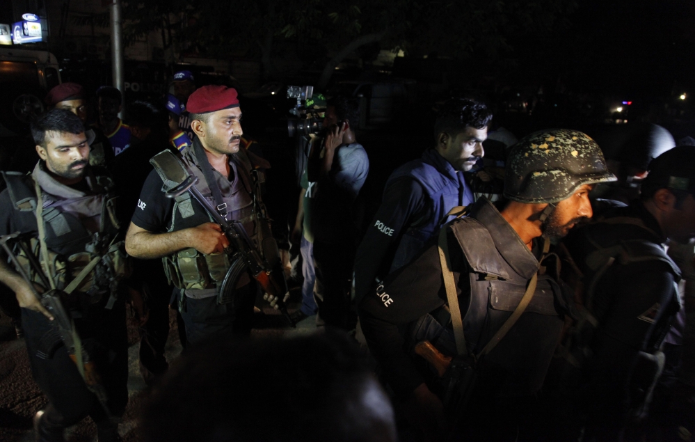Pakistani commandos get ready to enter Karachi airport terminal following attacks by unknown gunmen on Sunday night, in Pakistan. Gunmen stormed an airport terminal used for VIPs and cargo in Pakistan’s largest city on Sunday night, killing and wounding scores of people, officials said. The Associated Press 