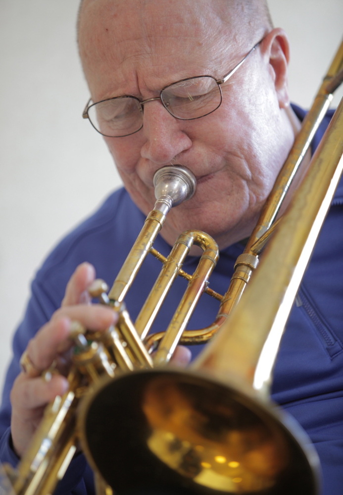 Photos by Amelia Kunhardt/Staff Photographer Trombonist Don Doane, who grew up in South Portland, practices at the Maine Veterans’ Home in Scarborough. Doane, 82, suffered a stroke in 2001 that paralyzed his left side, and plays a valve trombone because he can no longer hold a slide trombone.