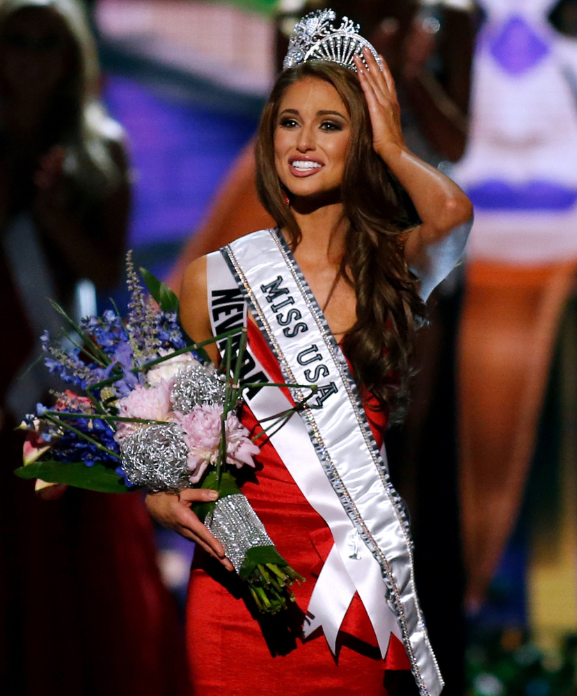 Miss Nevada USA Nia Sanchez adjusts her crown after being crowned the new Miss USA in Baton Rouge, La., on Sunday. The Associated Press