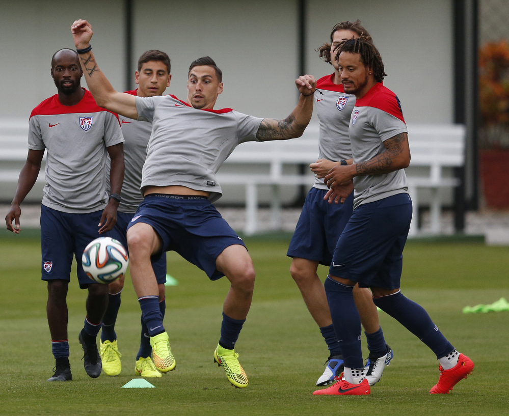 The Associated Press United States’ Geoff Cameron keeps a ball in the air during a drill with teammates at the Sao Paulo FC training center in Brazil on Monday. The U.S. will begin play on June 16.