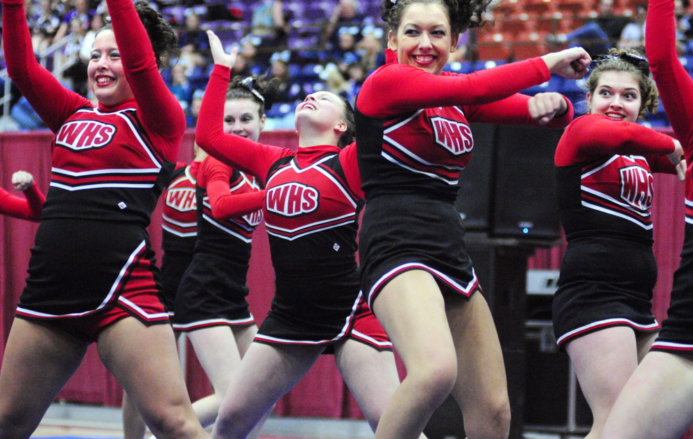Joe Phelan / Kennebec Journal Staff Photographer The Wells team performs during the state cheerleading championships at the Augusta Civic Center in this 2012 file photo.