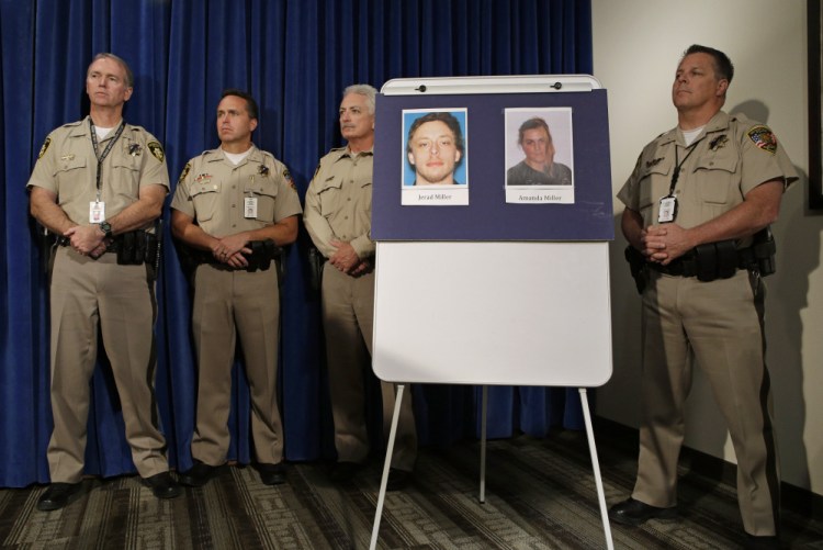 Pictures of suspects Jerad Miller and Amanda Miller are on display during a news conference, Monday in Las Vegas. The Associated Press