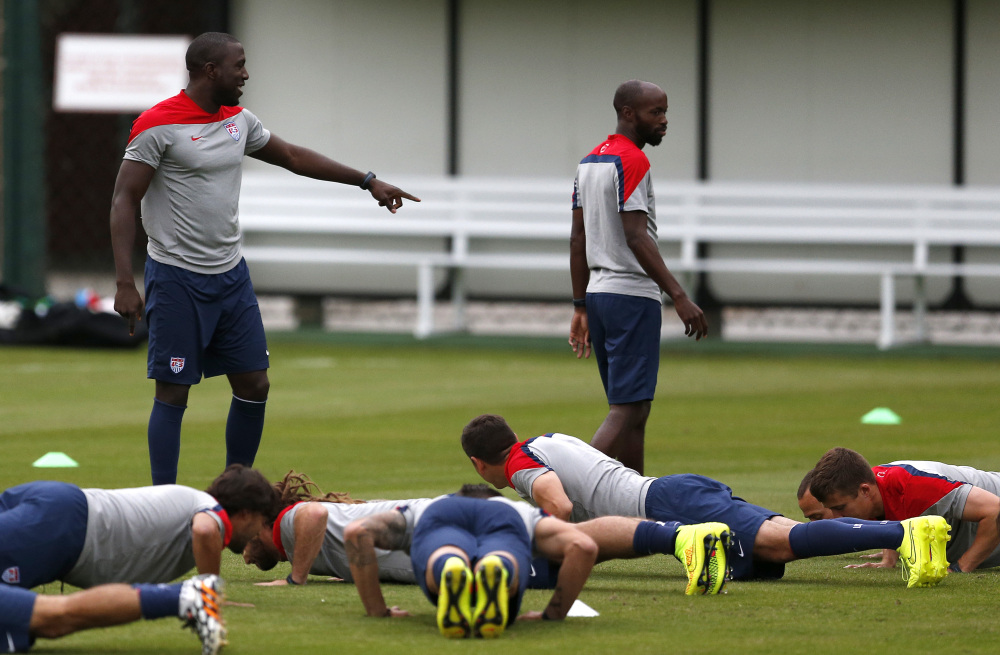 United States’ Jozy Altidore, top left, gestures to teammate DaMarcus Beasley as teammates do push-ups during a training session at the Sao Paulo FC training center in Sao Paulo, Brazil, on Monday. 